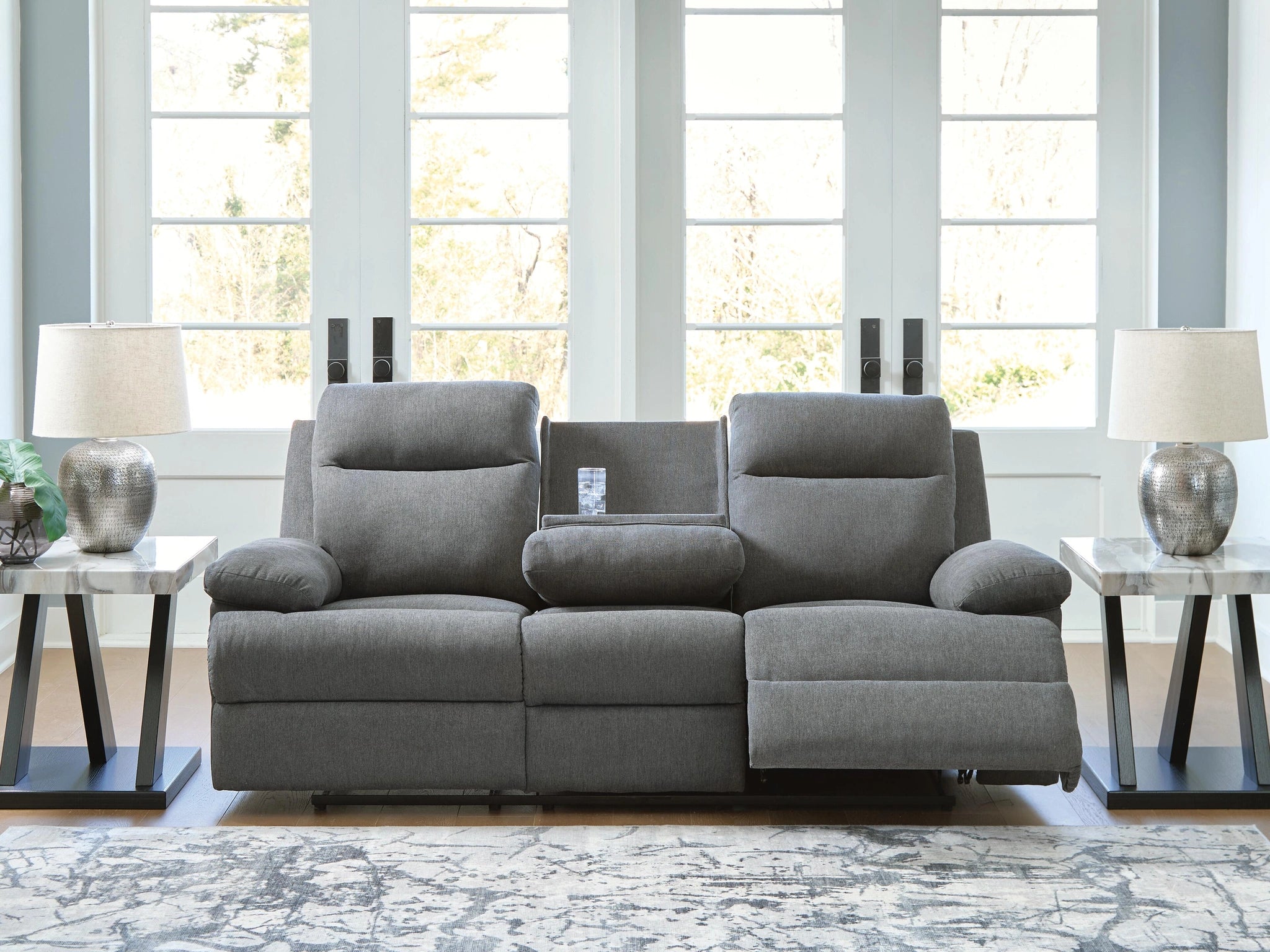 Sofá reclinable de desplazamiento lateral con mesa abatible