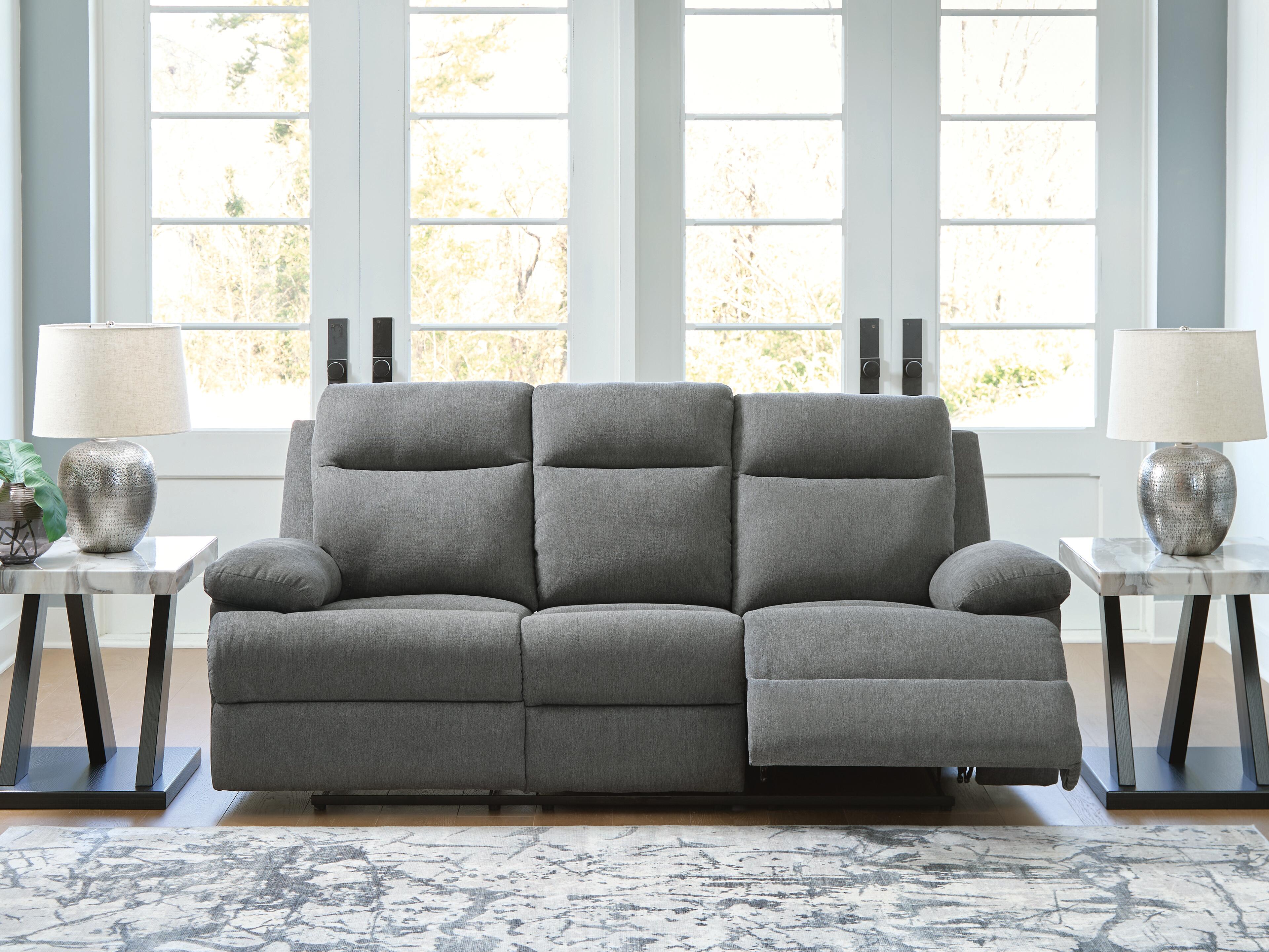 Sofá reclinable de desplazamiento lateral con mesa abatible